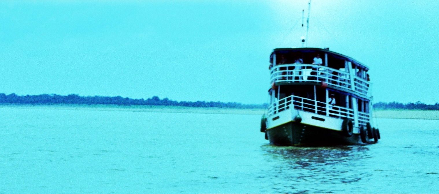 A double-decker Amazon riverboat on the water